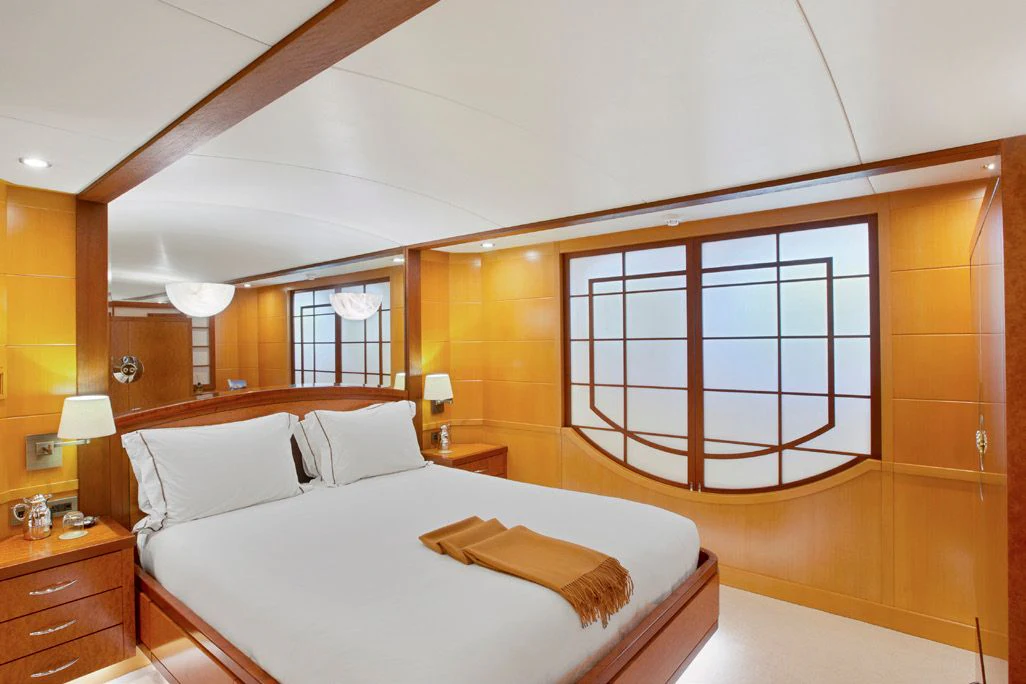 a bedroom with a large bed aboard HERCULES Yacht for Sale