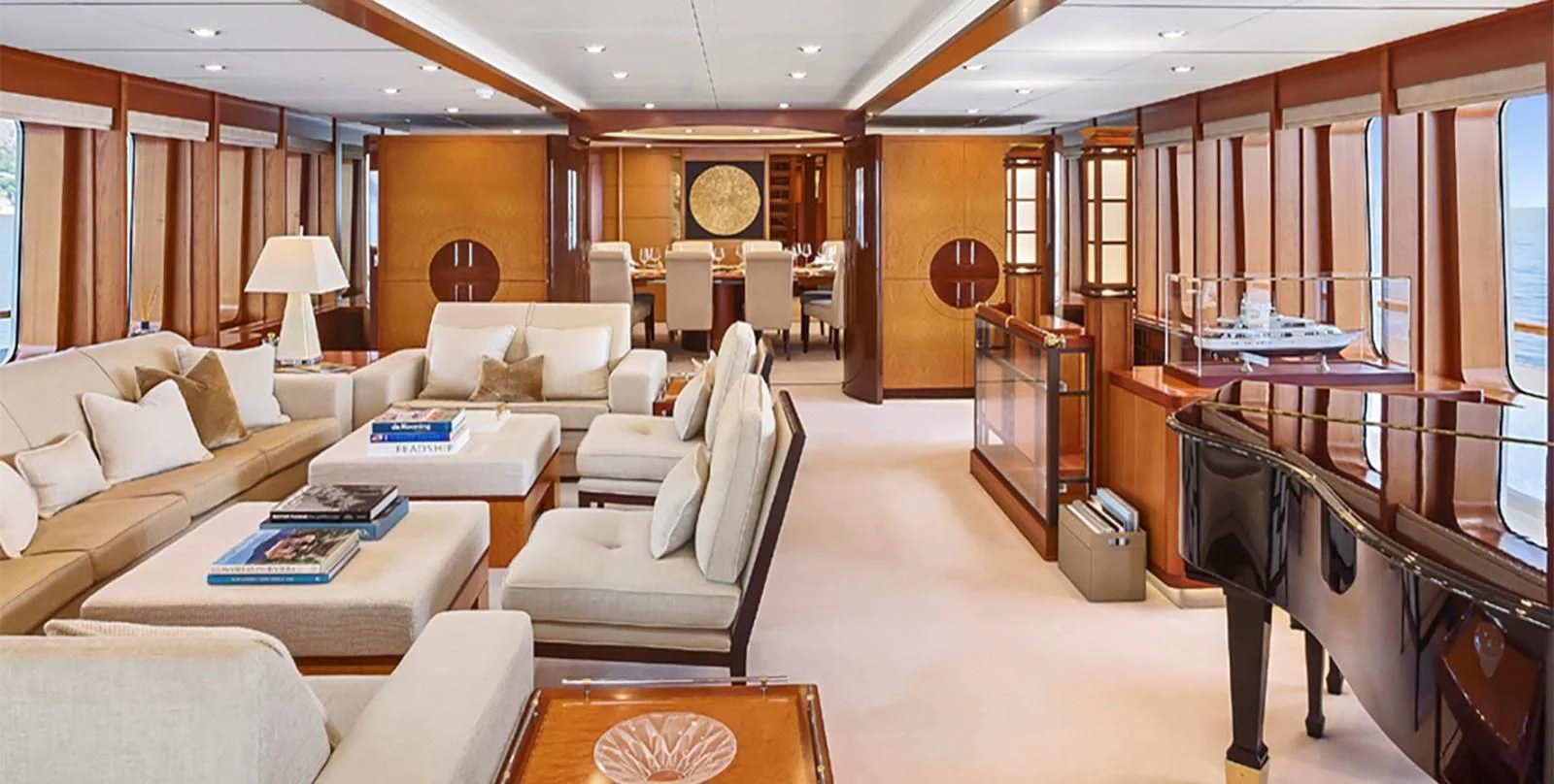 a large living room with a piano aboard HERCULES Yacht for Sale