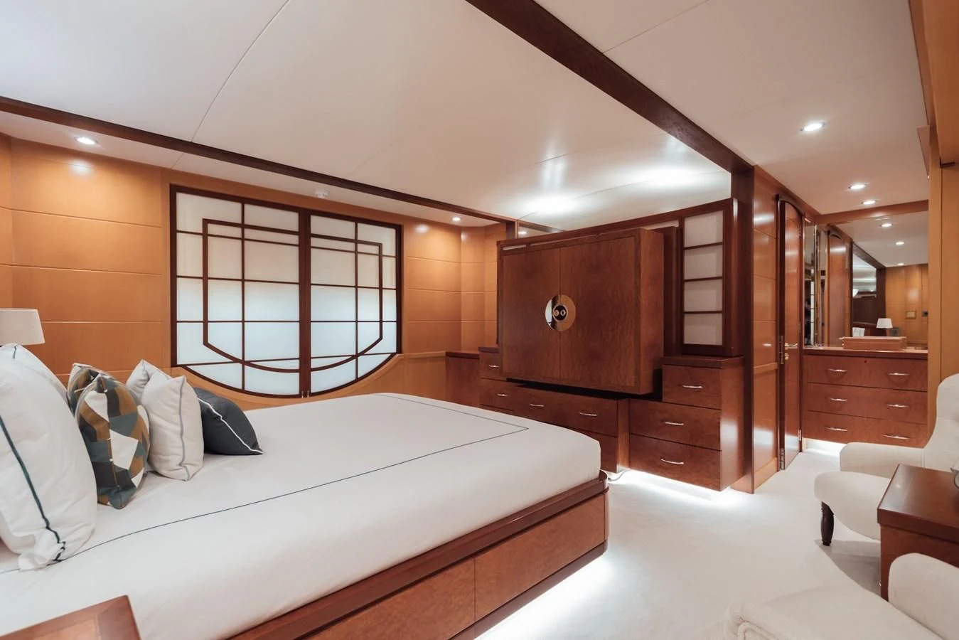 a bedroom with a bed and a window aboard HERCULES Yacht for Sale
