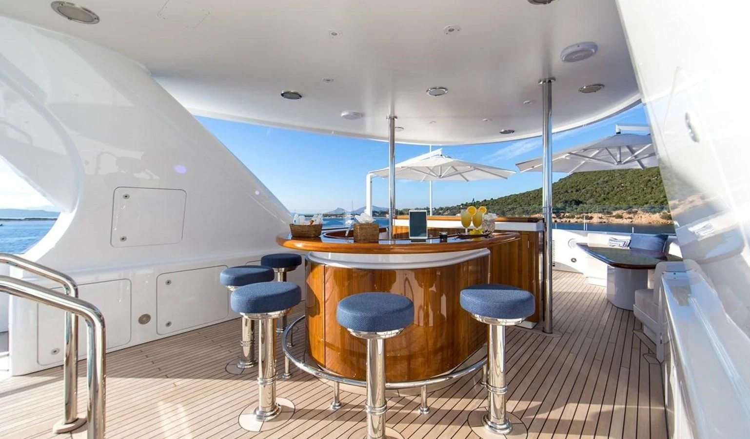 a room with a table and chairs aboard HERCULES Yacht for Sale