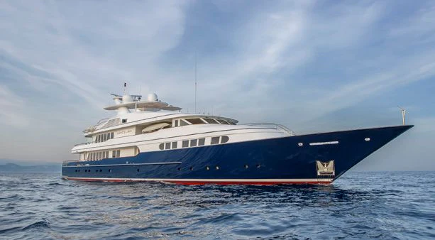 a large white boat in the water aboard HERCULES Yacht for Sale