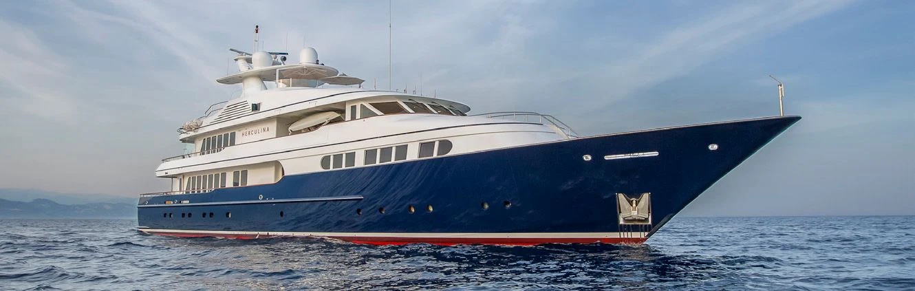 a large white yacht in the water aboard HERCULES Yacht for Sale