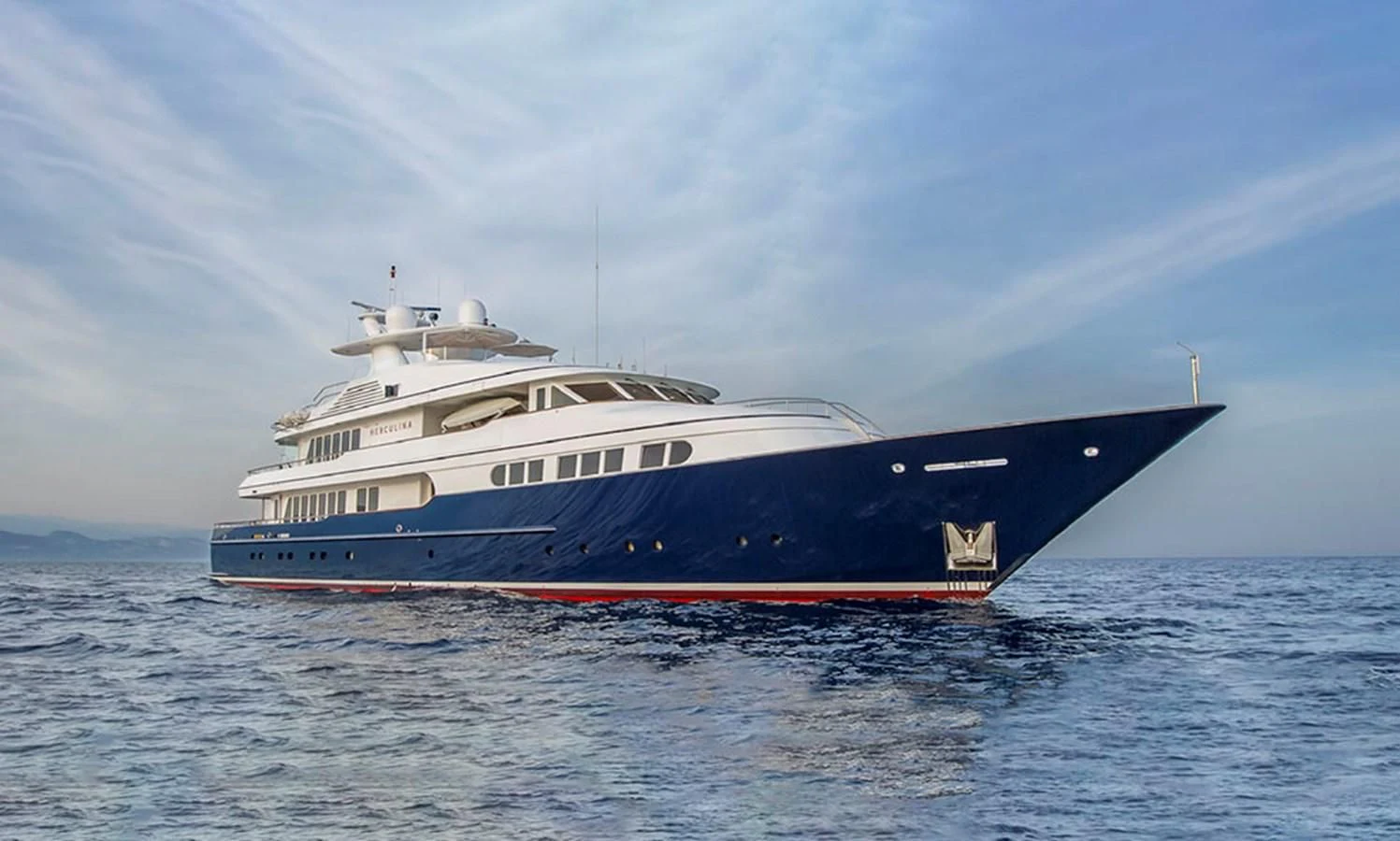 a large boat in the water aboard HERCULES Yacht for Sale