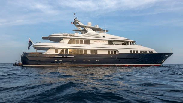 a large ship in the water aboard HERCULES Yacht for Sale