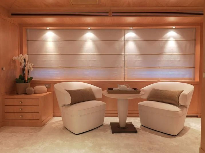 a room with a toilet and a chair aboard EILEEN Yacht for Sale