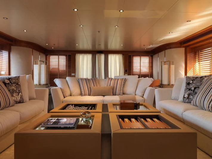 a living room with white couches aboard EILEEN Yacht for Sale