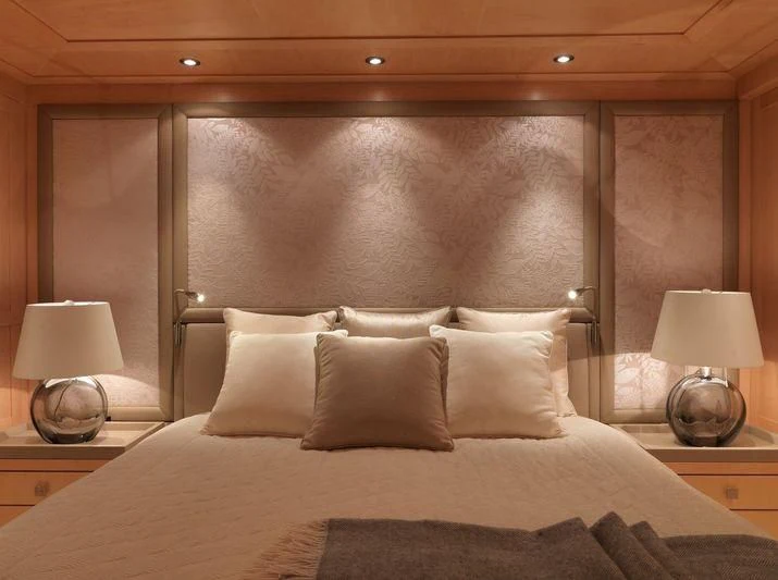 a bed with a lamp on it aboard EILEEN Yacht for Sale