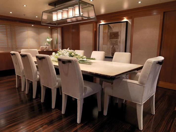 a table with white chairs aboard EILEEN Yacht for Sale