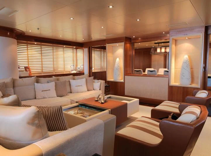 a room with couches and a coffee table aboard EILEEN Yacht for Sale