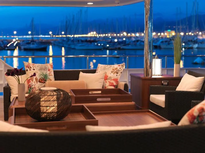 a living room with a view of the water and a city aboard EILEEN Yacht for Sale
