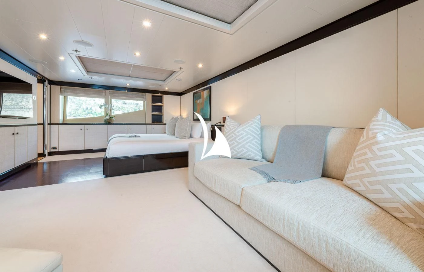 a living room with a couch and a large window aboard GRACE (YET) Yacht for Sale