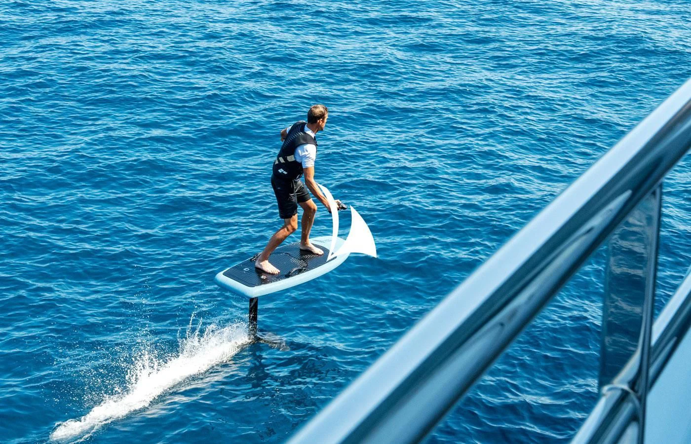 a man surfing on the sea aboard GRACE (YET) Yacht for Sale