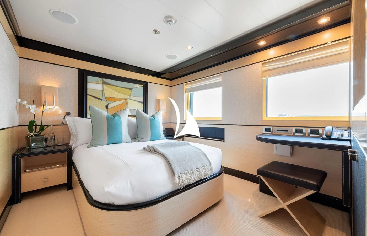 a bedroom with a bed and desk aboard GRACE (YET) Yacht for Sale
