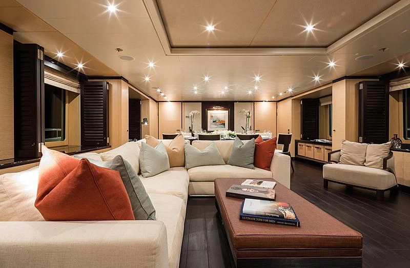 a living room with a couch and a coffee table aboard GRACE (YET) Yacht for Sale