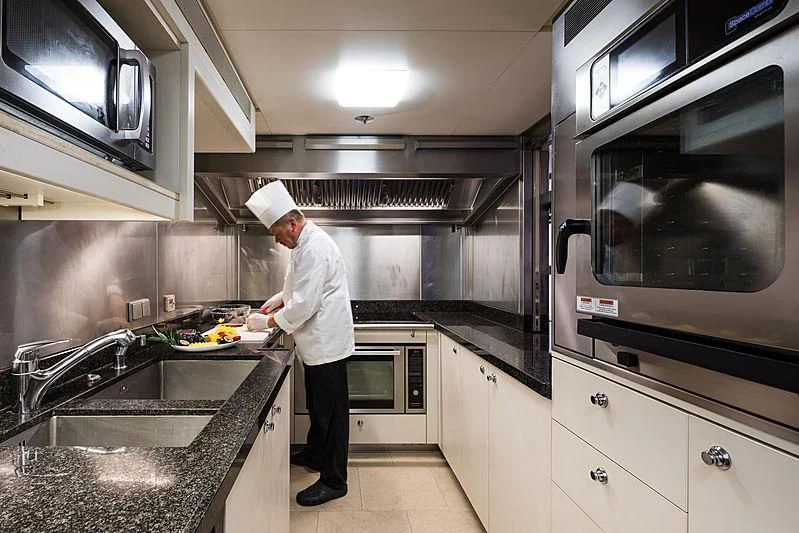 a chef in a kitchen aboard GRACE (YET) Yacht for Sale