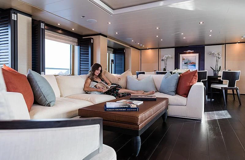 a person sitting on a couch aboard GRACE (YET) Yacht for Sale