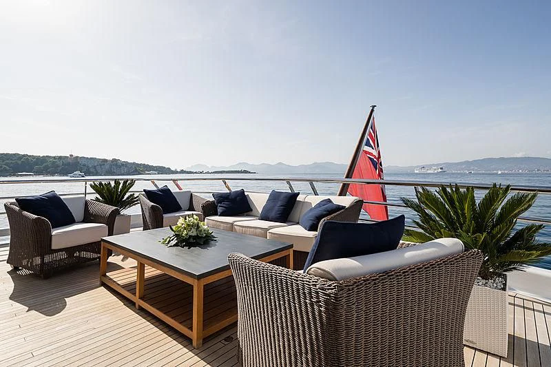 a patio with a table and chairs aboard GRACE (YET) Yacht for Sale