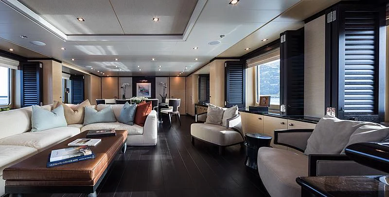a living room with a couch and a coffee table aboard GRACE (YET) Yacht for Sale