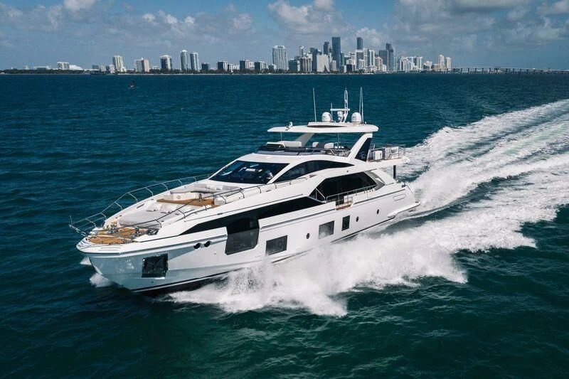 a white yacht on the water aboard ECLIPSE Yacht for Sale