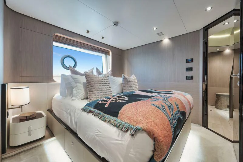 a bedroom with a bed and a mirror aboard ECLIPSE Yacht for Sale