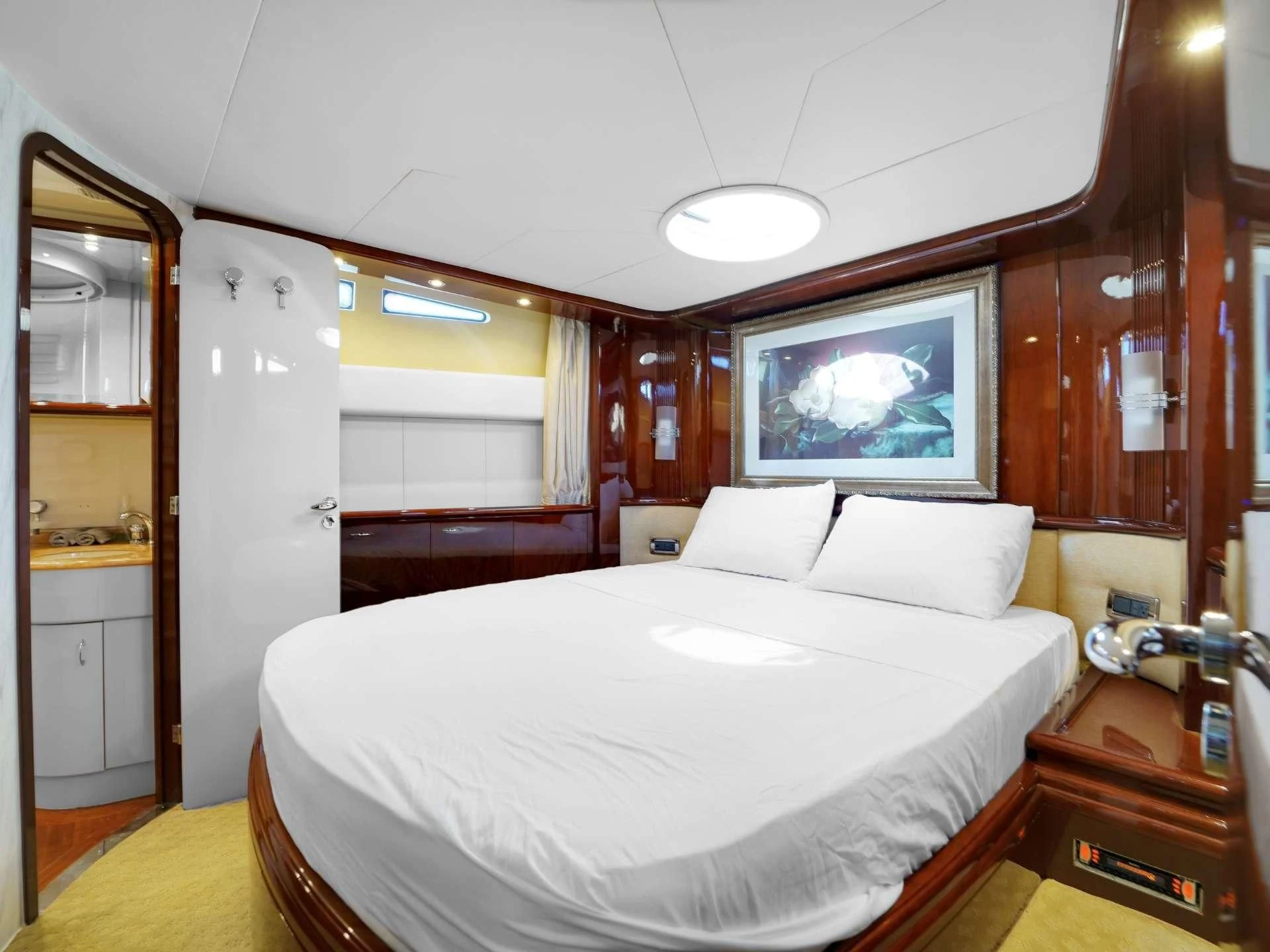 a bedroom with a large bed aboard DELMAR Yacht for Sale