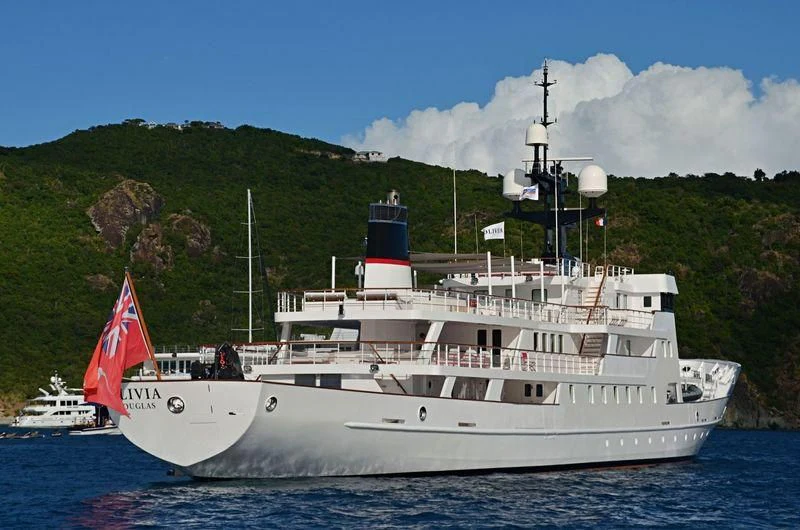 a large white boat on the water aboard JESTER Yacht for Sale