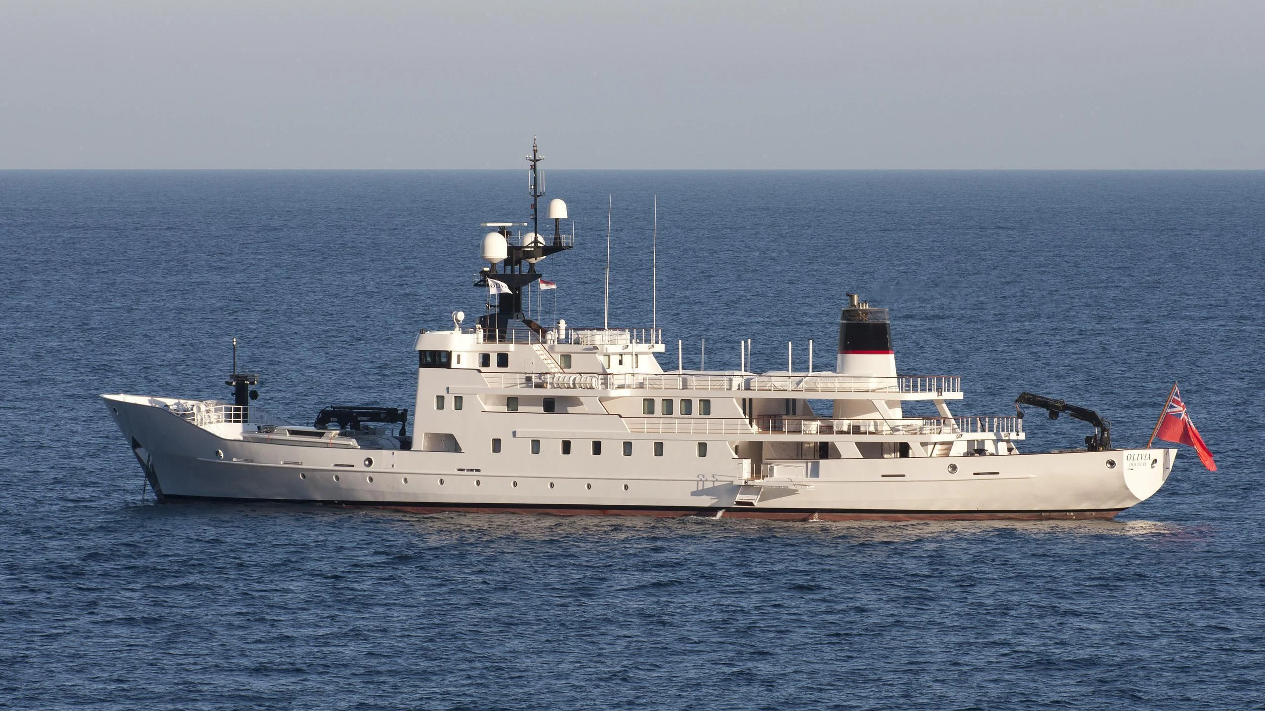 a large white ship in the water aboard JESTER Yacht for Sale