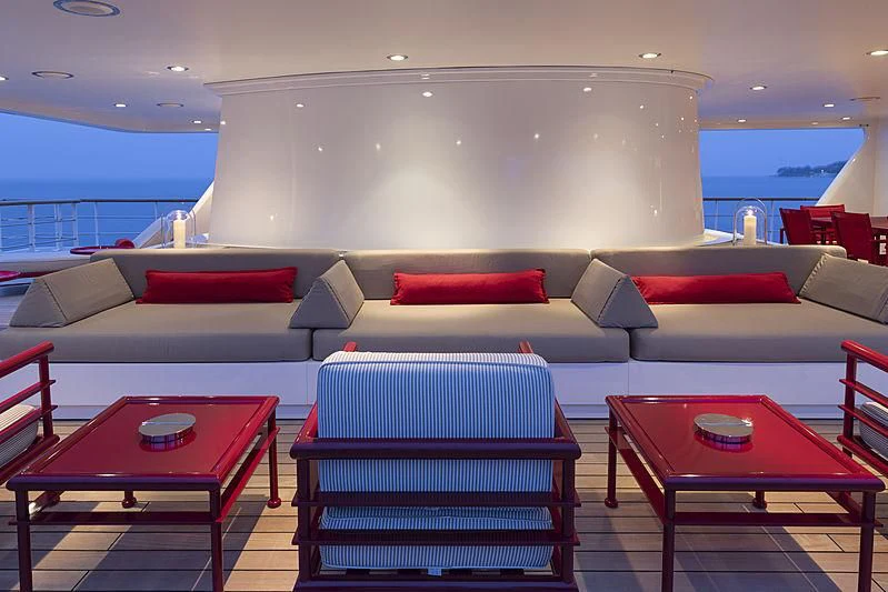a room with a couch and a table aboard JESTER Yacht for Sale