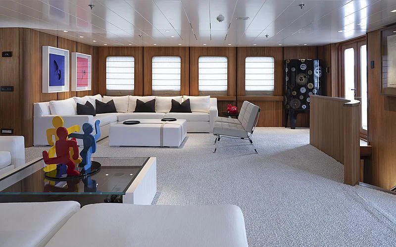 a living room with a couch and a coffee table aboard JESTER Yacht for Sale