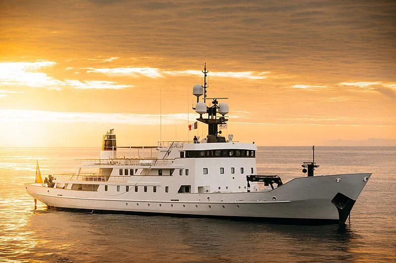 a large white ship in the water aboard JESTER Yacht for Sale