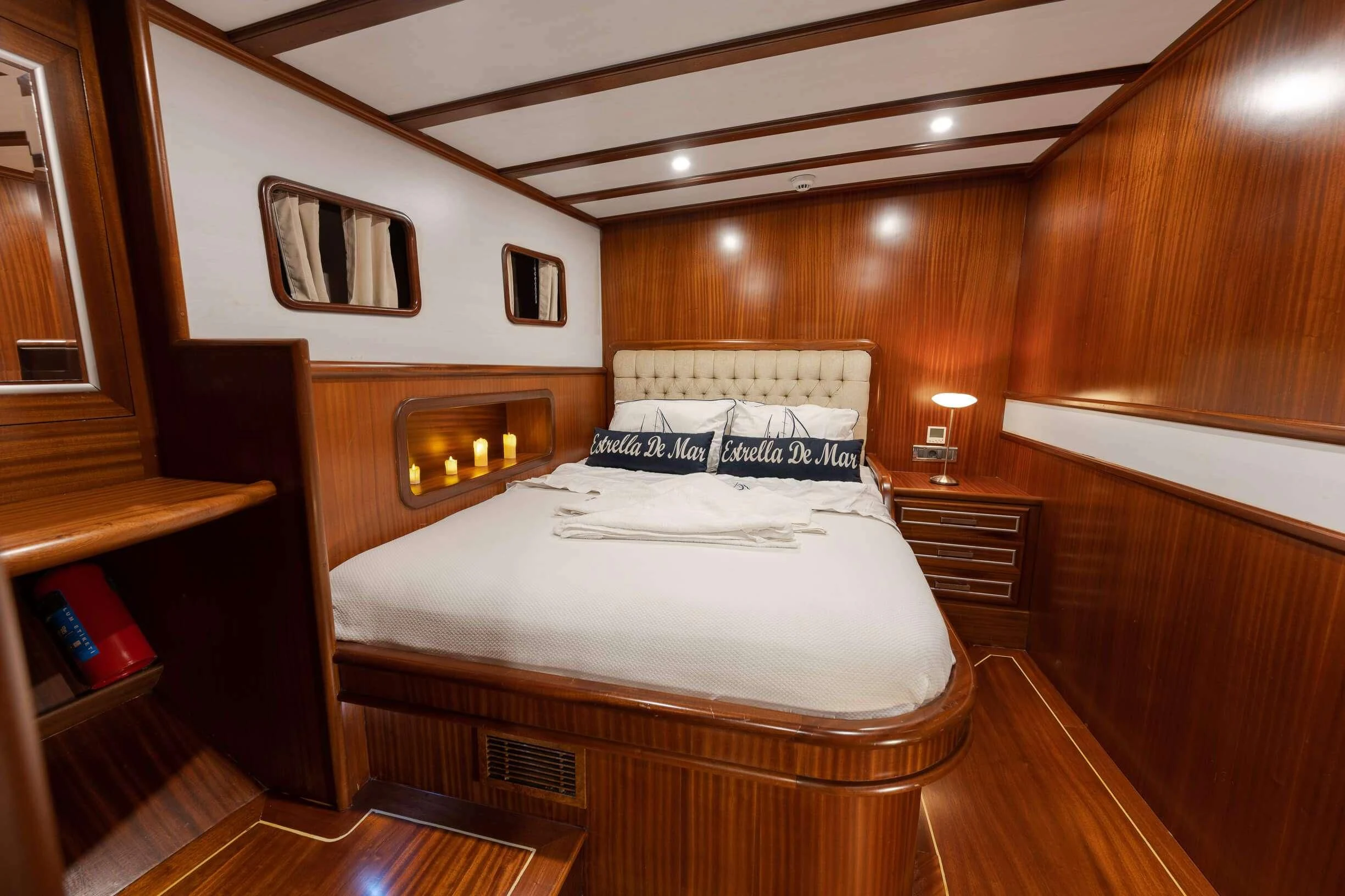a bedroom with a bed and a television aboard ESTRELLA DE MAR Yacht for Sale