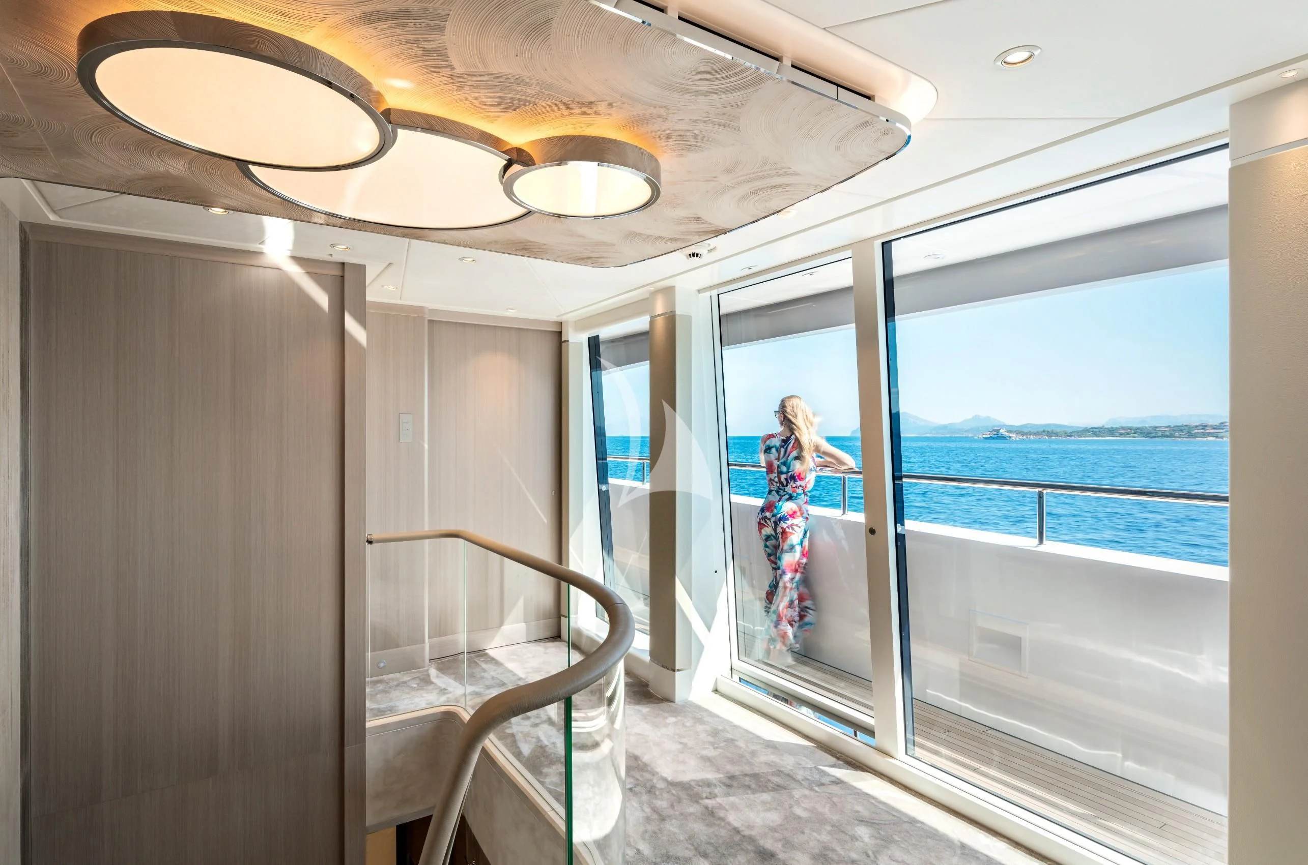 a person standing on a balcony aboard IRISHA Yacht for Sale