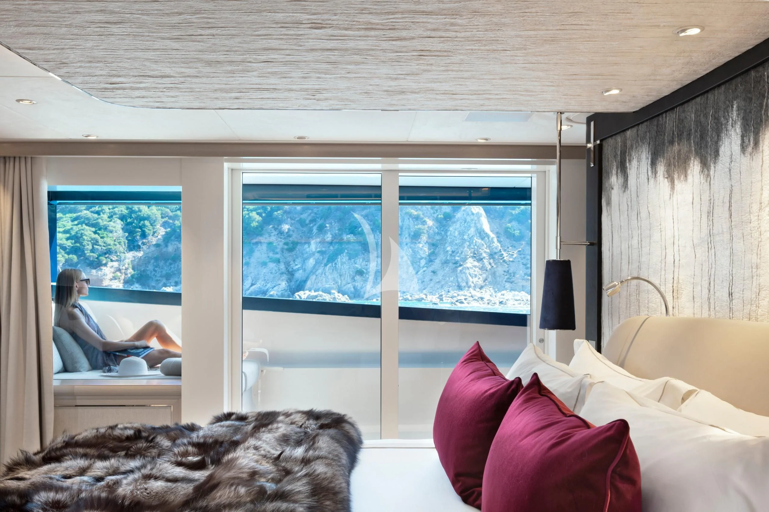 a room with a bed and a window aboard IRISHA Yacht for Sale
