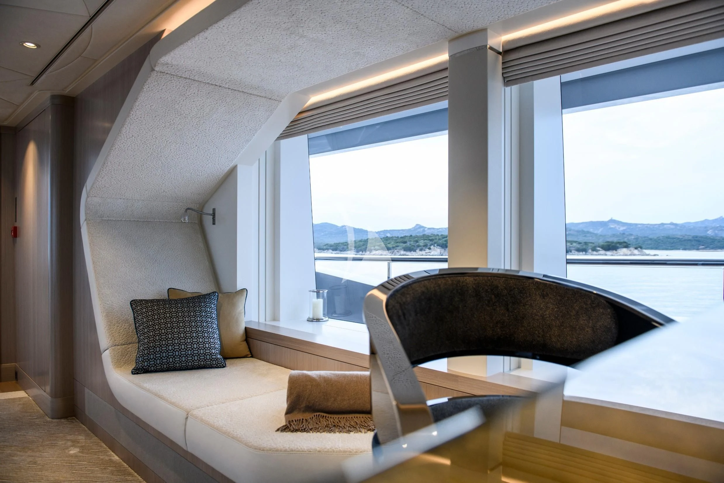 a room with a couch and a window aboard IRISHA Yacht for Sale