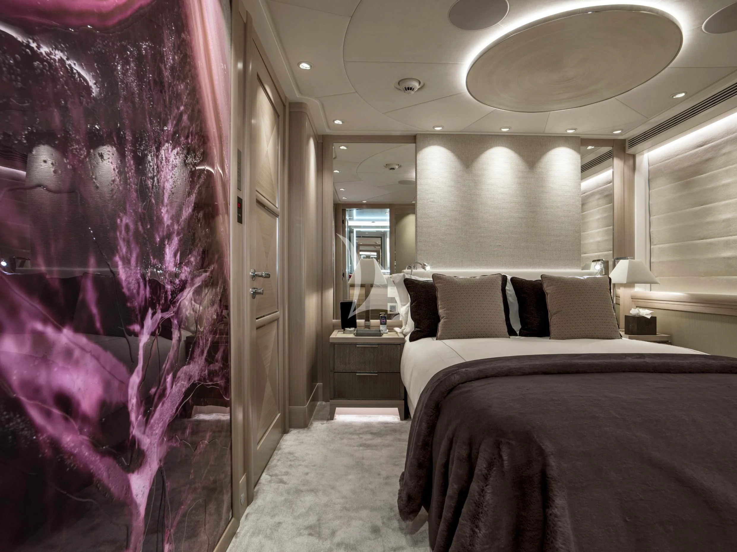 a bedroom with a large window aboard IRISHA Yacht for Sale