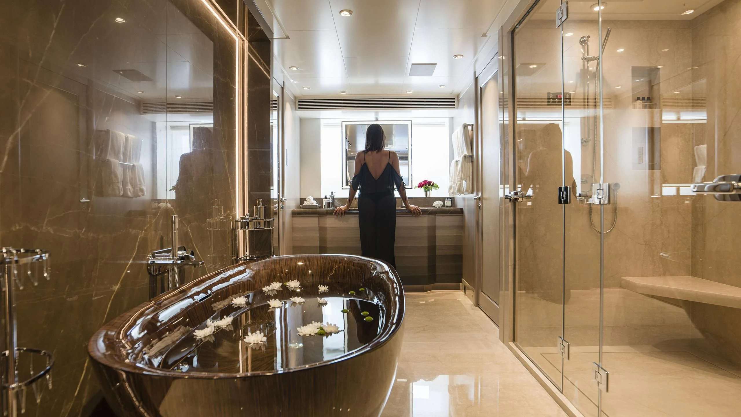a person in a bathroom aboard IRISHA Yacht for Sale