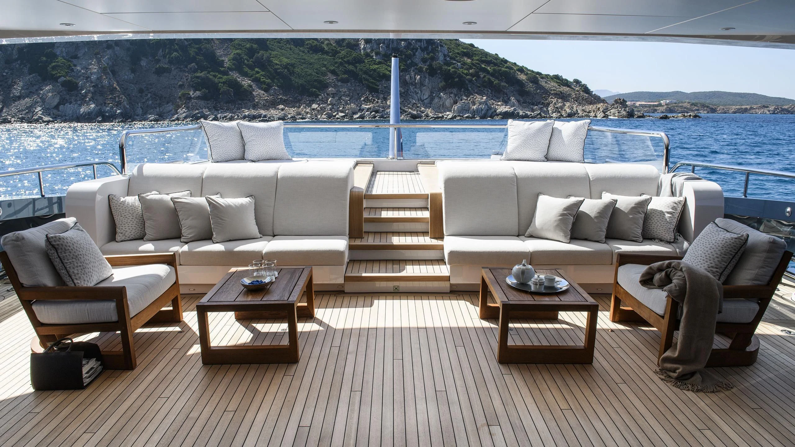 a living room with a couch and a table aboard IRISHA Yacht for Sale