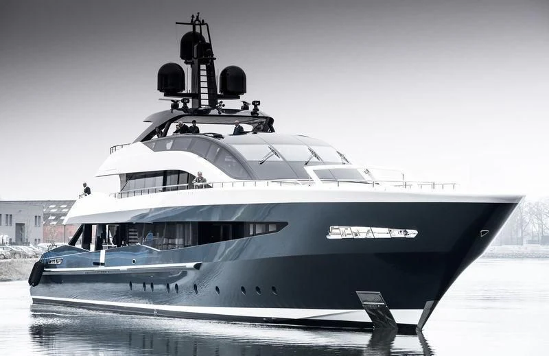 a white yacht on a dock aboard IRISHA Yacht for Sale