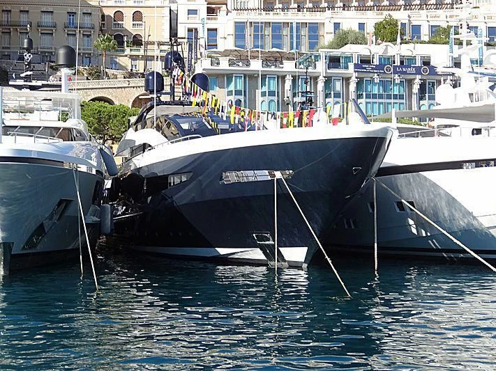 several boats docked at a pier aboard IRISHA Yacht for Sale
