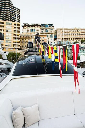a car with flags on it aboard IRISHA Yacht for Sale