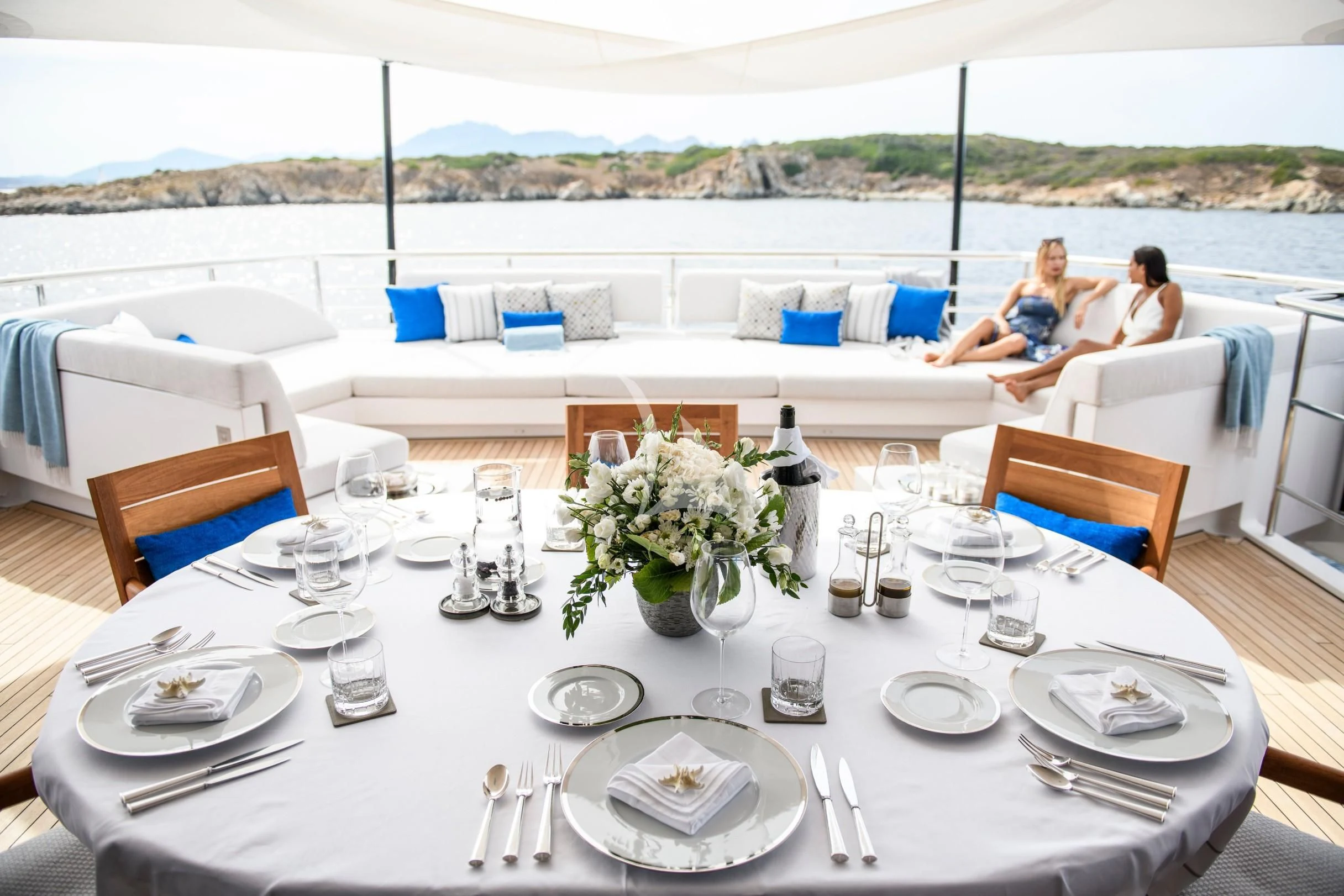 a table set for a dinner aboard IRISHA Yacht for Sale