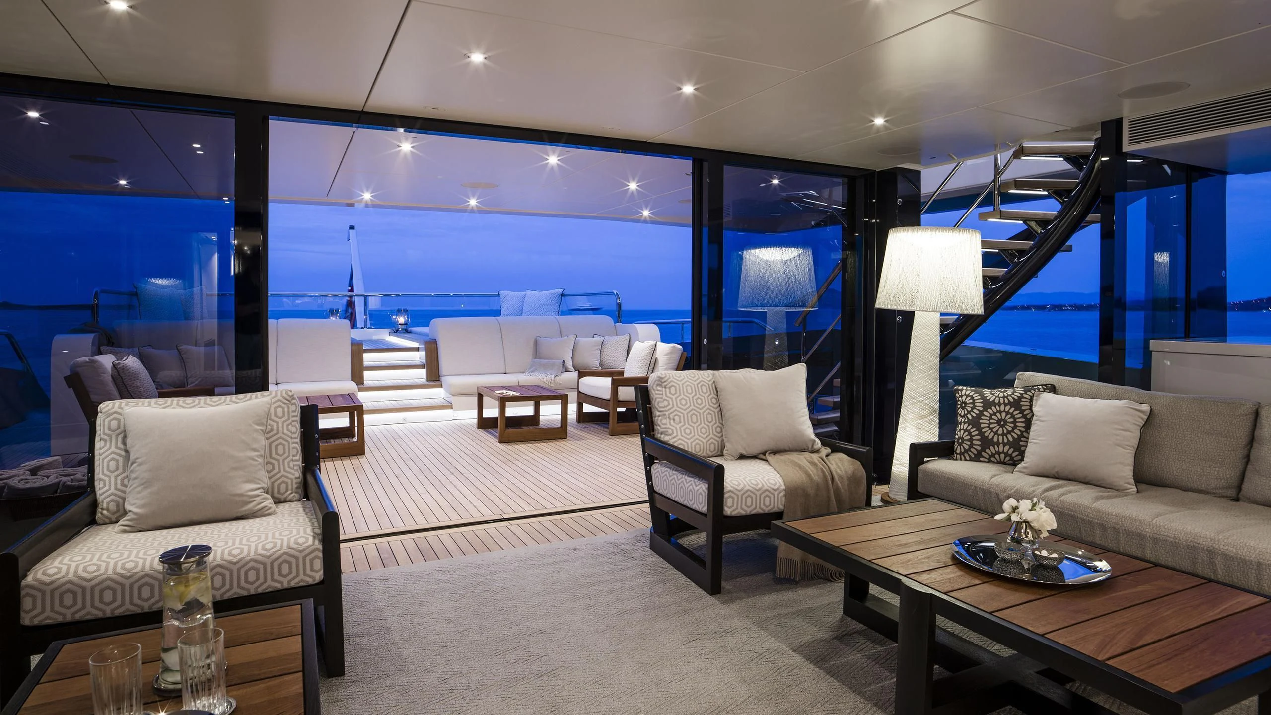 a living room with a large window aboard IRISHA Yacht for Sale