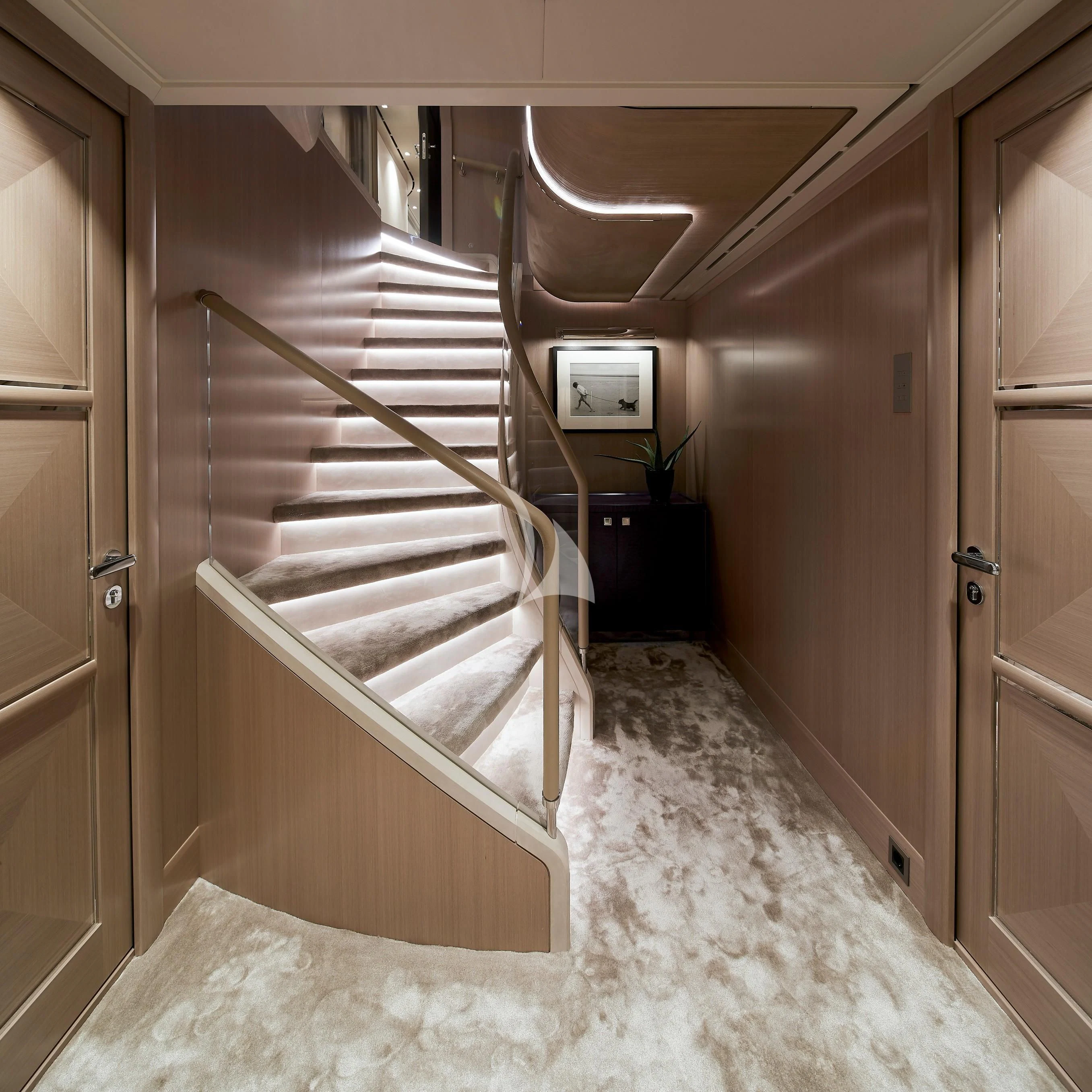 a room with wooden stairs aboard IRISHA Yacht for Sale