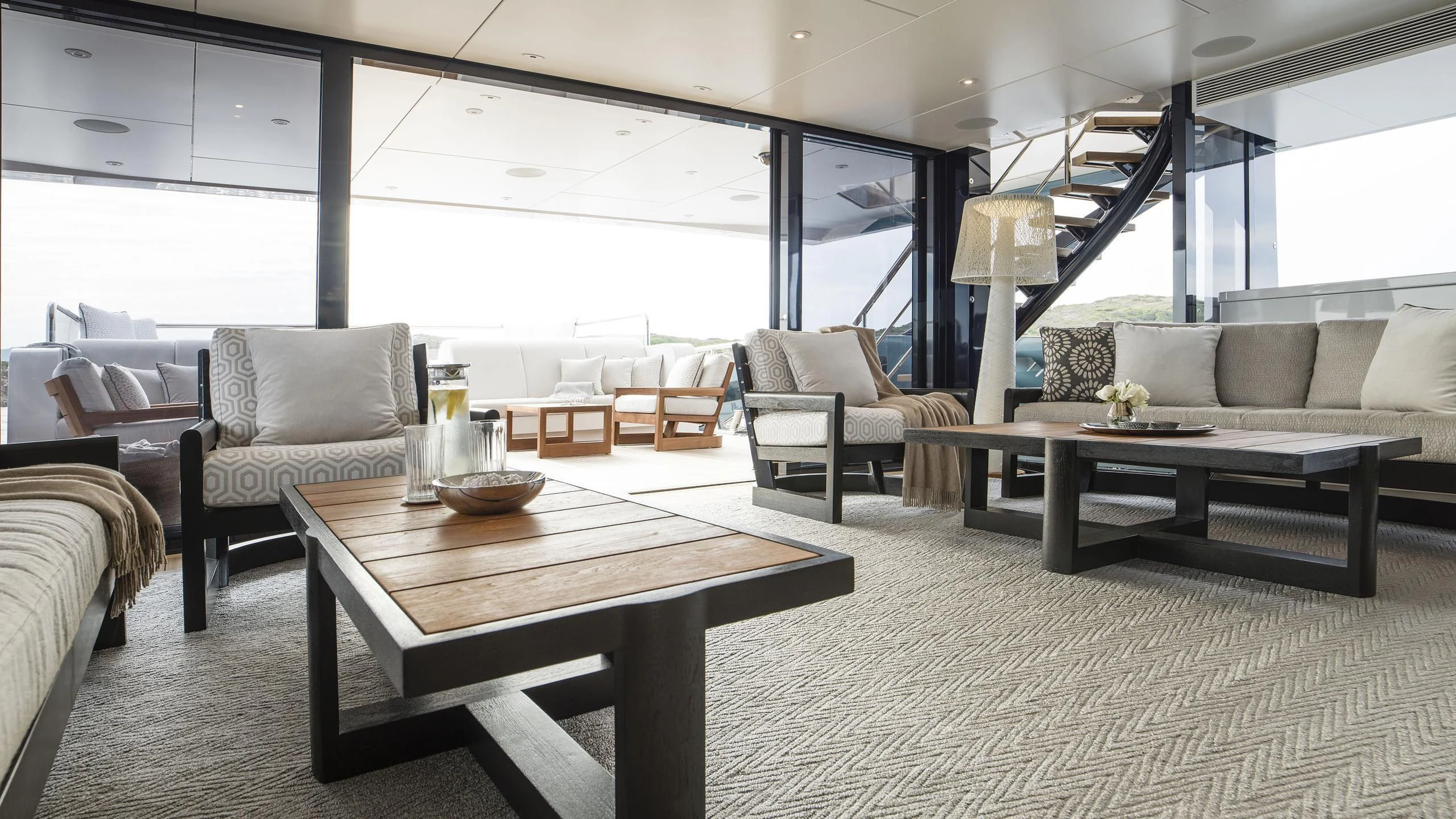 a living room with a large window aboard IRISHA Yacht for Sale
