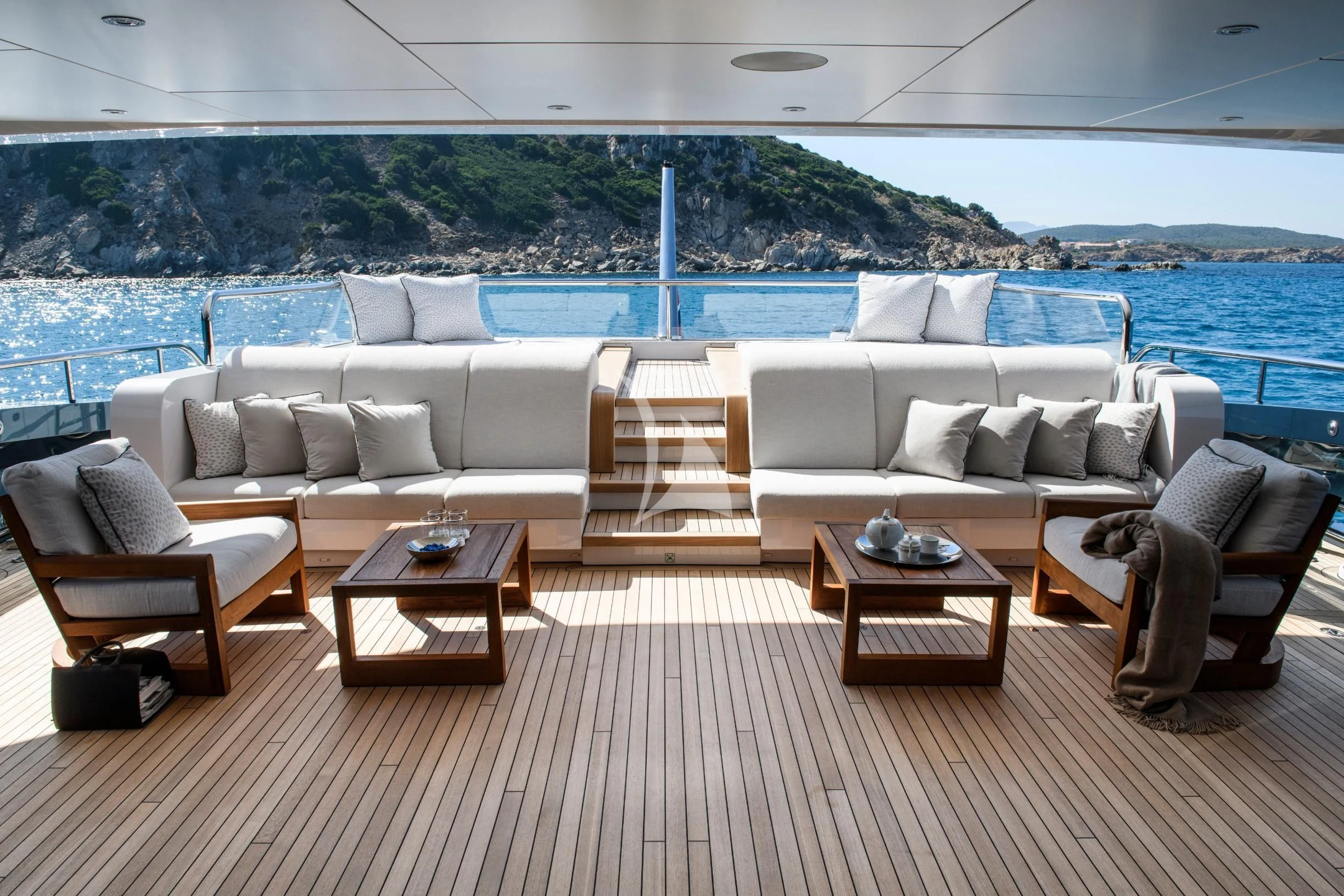 a living room with a large pool aboard IRISHA Yacht for Sale