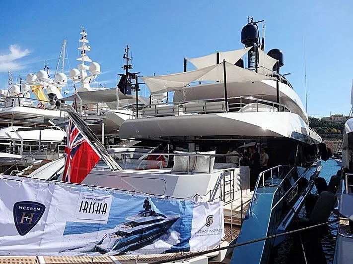 a boat with flags on it aboard IRISHA Yacht for Sale