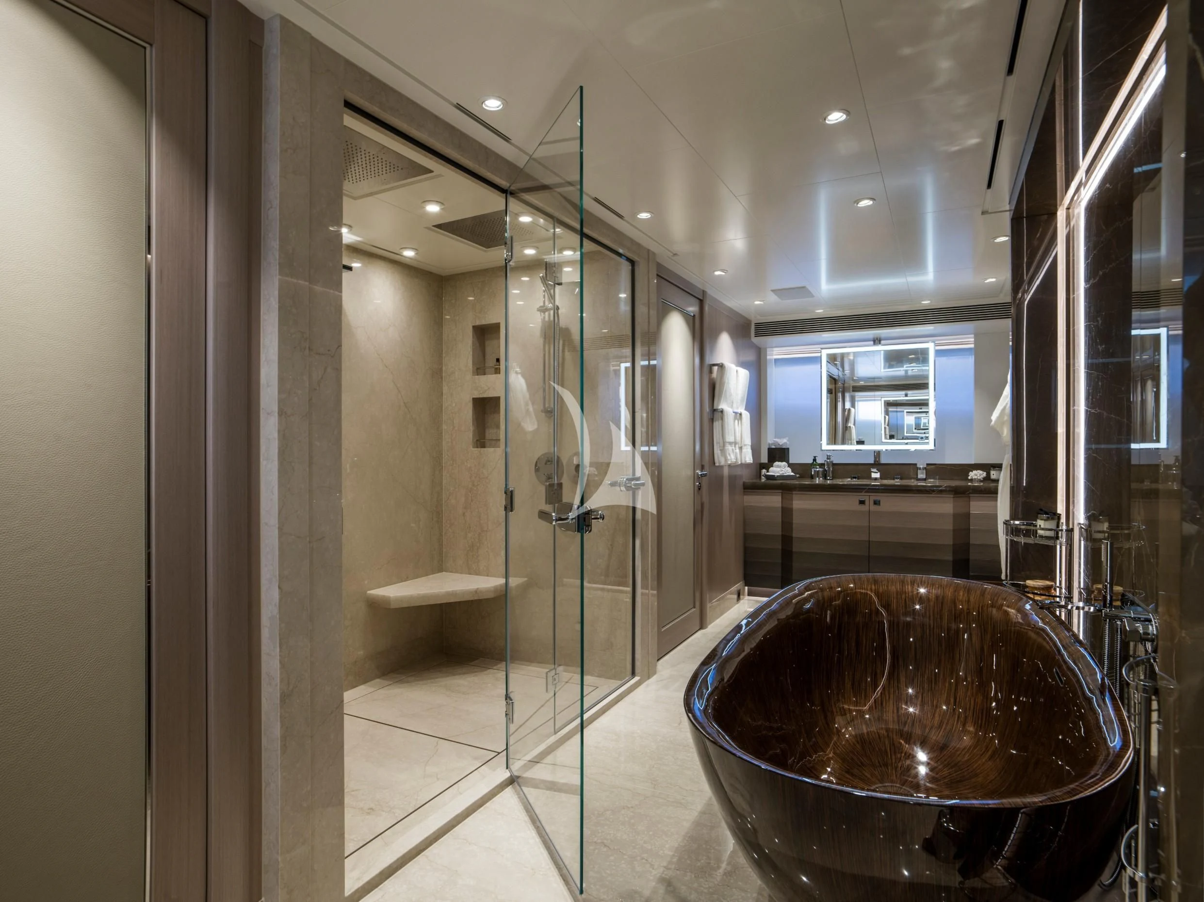 a bathroom with a large round tub aboard IRISHA Yacht for Sale