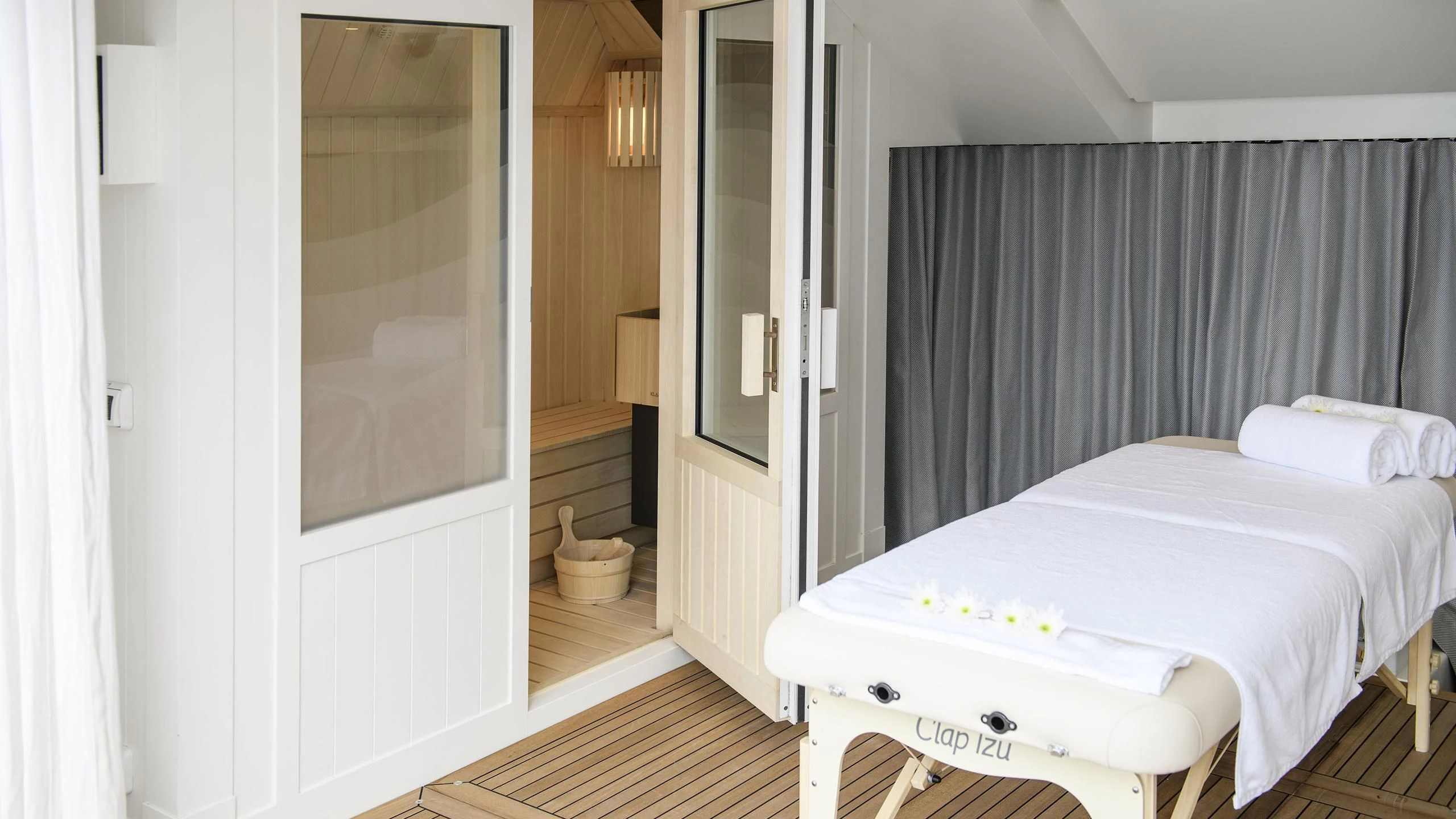 a bedroom with a bed and a mirror aboard IRISHA Yacht for Sale