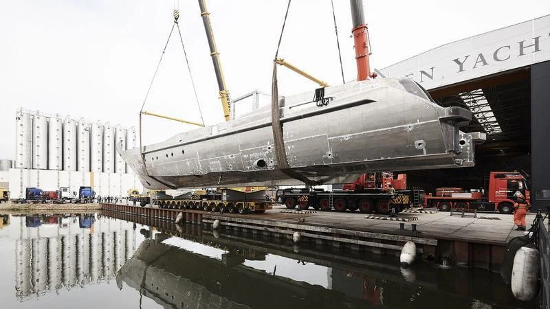 a large white boat docked aboard IRISHA Yacht for Sale