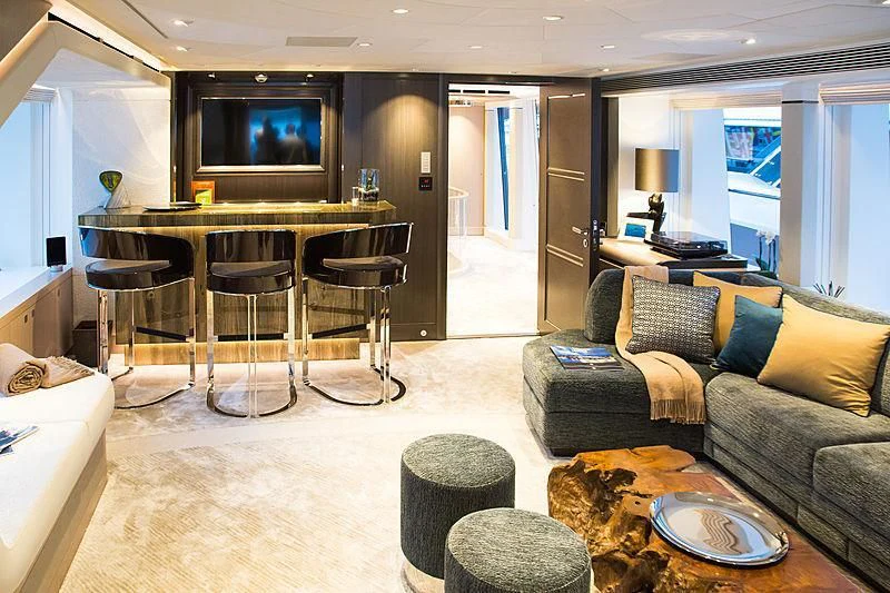 a living room with a couch and a table aboard IRISHA Yacht for Sale
